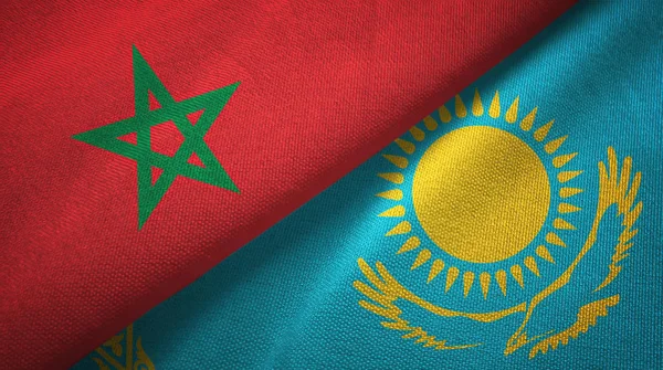 Marokko en Kazachstan twee vlaggen textiel doek, stof textuur — Stockfoto
