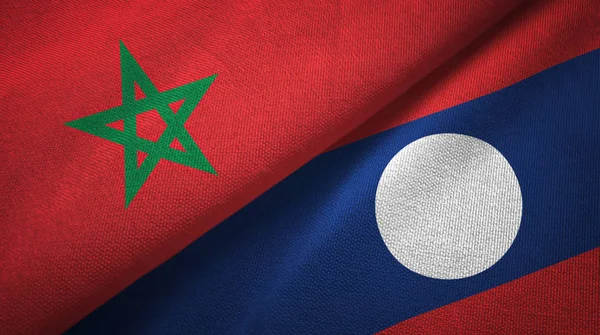 Marokko en Laos twee vlaggen textiel doek. — Stockfoto