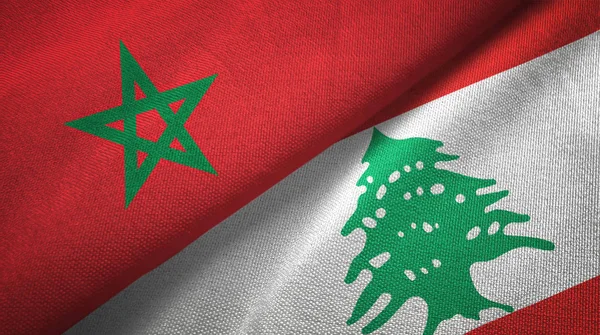 Marokko en Libanon twee vlaggen textiel doek, stof textuur — Stockfoto