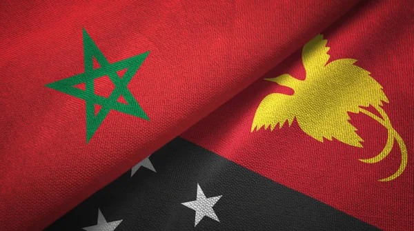 Marokko en Papoea-Nieuw-Guinea twee vlaggen textiel doek, stof textuur — Stockfoto