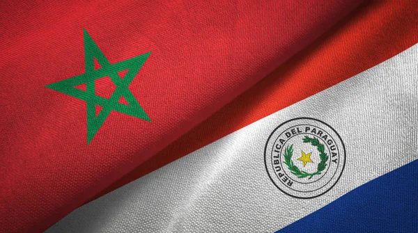 Marokko en Paraguay twee vlaggen textiel doek, stof textuur — Stockfoto
