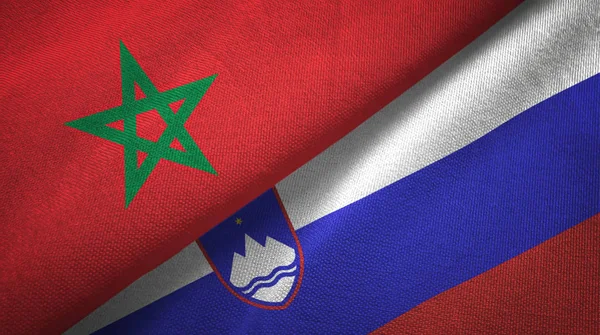 Marokko en Slovenië twee vlaggen textiel doek, weefsel textuur — Stockfoto