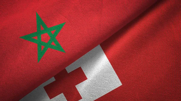 Marokko en Tonga twee vlaggen textiel doek, weefsel textuur — Stockfoto