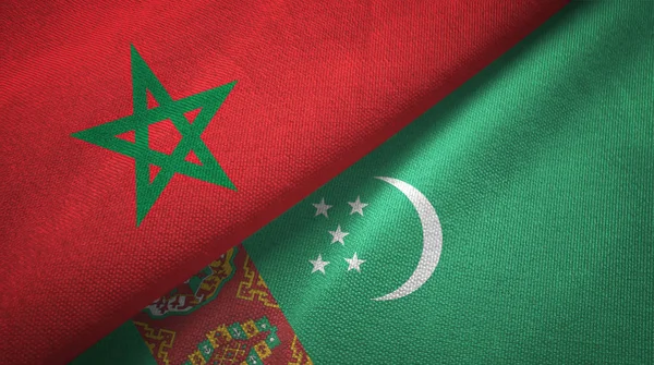 Marokko en Turkmenistan twee vlaggen textiel doek, weefsel textuur — Stockfoto