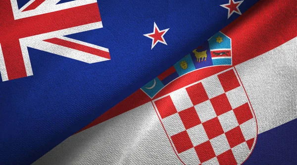 Nueva Zelanda y Croacia dos banderas tela textil, textura de la tela — Foto de Stock