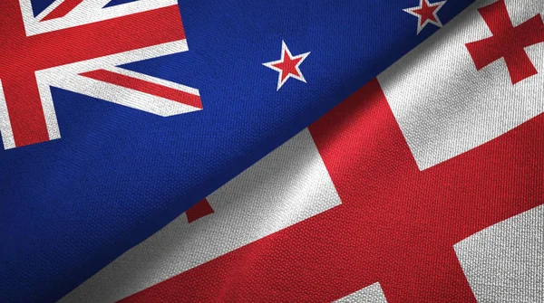 ニュージーランドとジョージアの2つの旗織物布、生地の質感 — ストック写真