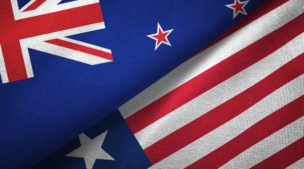 New Zealand and Liberia two flags textile cloth, fabric texture — Stock Photo, Image