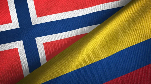 Noruega e Colômbia duas bandeiras de pano têxtil, textura de tecido — Fotografia de Stock