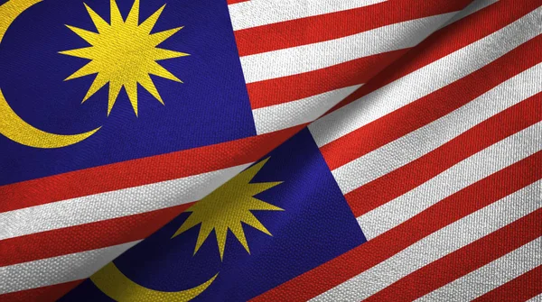 Malásia duas bandeiras de pano têxtil, textura de tecido — Fotografia de Stock