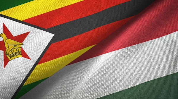 Zimbabwe and Hungary two flags textile cloth, fabric texture