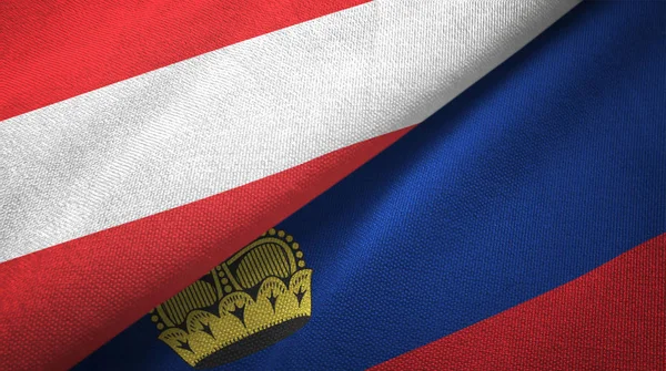 Austria e Liechtenstein due bandiere tessuto, tessitura tessuto — Foto Stock