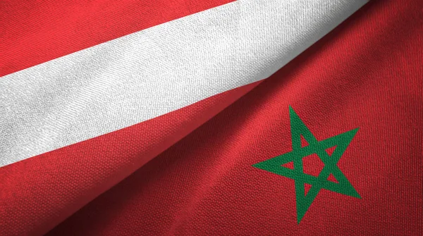 Oostenrijk en Marokko twee vlaggen textiel doek, weefsel textuur — Stockfoto