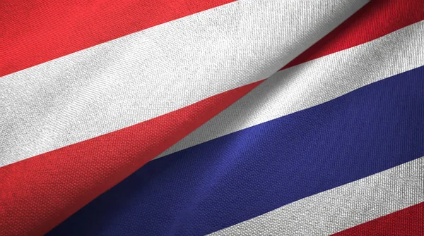Австрия и Таиланд два флага текстильная ткань, текстура ткани — стоковое фото