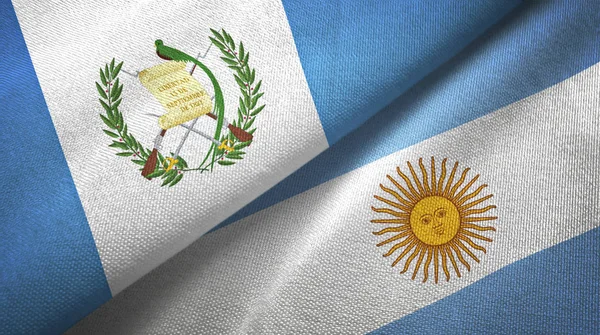 Guatemala och Argentina två flaggor textil trasa, tyg konsistens — Stockfoto