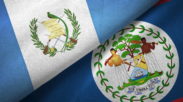 Guatemala e Belize duas bandeiras de pano têxtil, textura de tecido — Fotografia de Stock
