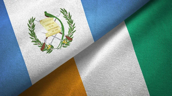 Guatemala e Costa do Marfim Marfim duas bandeiras textura de tecido têxtil — Fotografia de Stock
