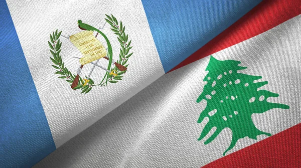 Guatemala et Liban deux drapeaux tissu textile, texture du tissu — Photo