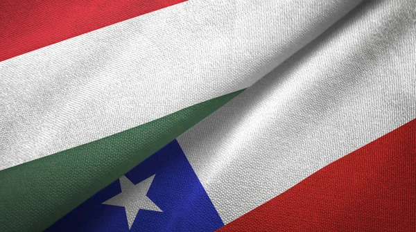 Hongarije en Chili twee vlaggen textiel doek, weefsel textuur — Stockfoto