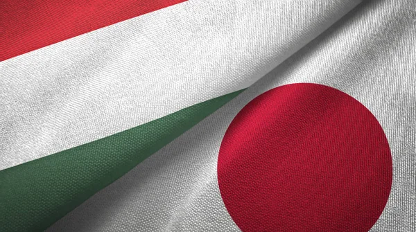 Hungría y Japón dos banderas tela textil, textura de la tela — Foto de Stock