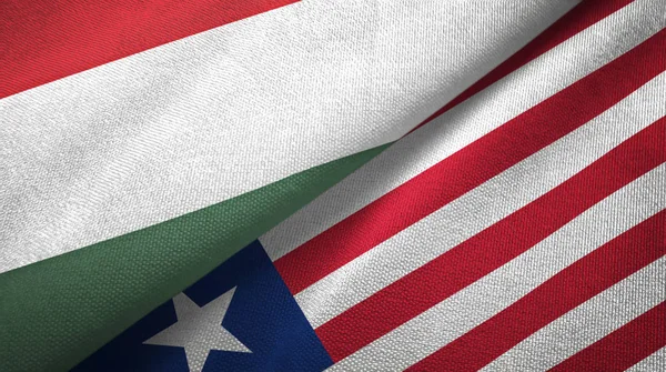 Hongarije en Liberia twee vlaggen textiel doek, weefsel textuur — Stockfoto