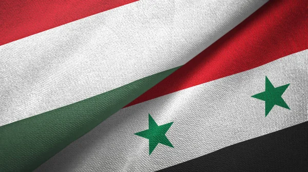 Maďarsko a Sýrie dvě vlajky textilní tkaniny, textura — Stock fotografie