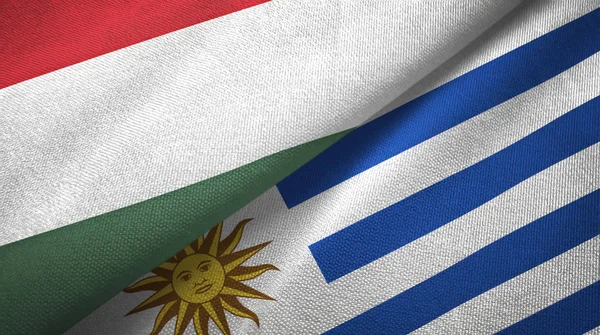 Ungarn und Uruguay zwei Flaggen Textiltuch, Textur — Stockfoto
