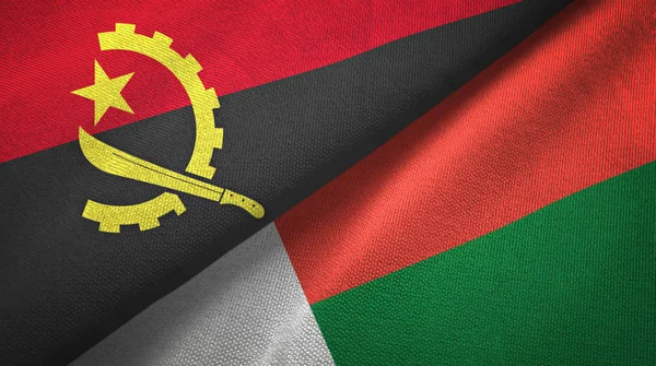 Angola ve Madagaskar iki bayraklar tekstil kumaş, kumaş doku — Stok fotoğraf