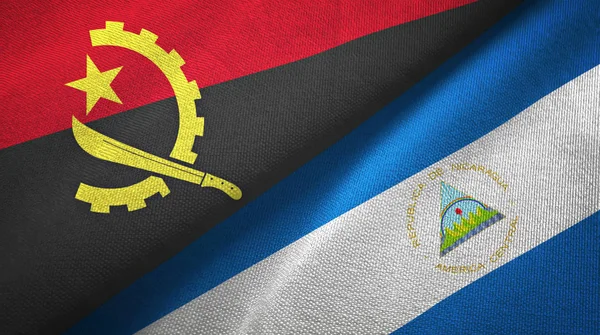 Angola ve Nikaragua iki bayraktekstil kumaş, kumaş doku — Stok fotoğraf