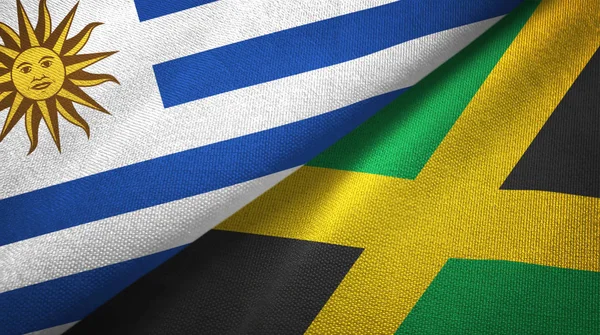 Uruguay und jamaica zwei flaggen textilgewebe, textur — Stockfoto