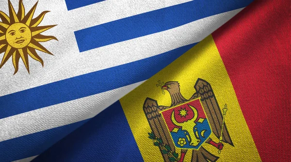 Uruguay und moldawien zwei flaggen textiltuch, textur — Stockfoto