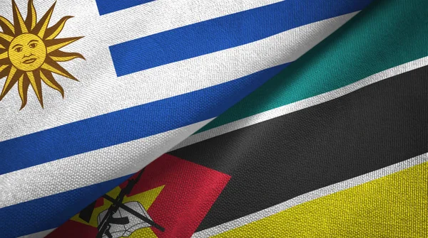 Uruguay und mozambique zwei flaggen textiltuch, textur — Stockfoto