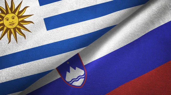 Uruguay und slowenien zwei flaggen textilstoff, textur — Stockfoto