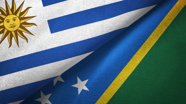 Uruguay and Solomon Islands two flags textile cloth, fabric texture