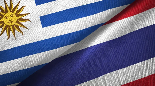 Uruguay und thailand zwei flaggen textiltuch, textur — Stockfoto