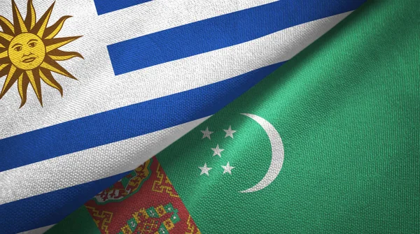 Уругвай и Туркменистан два флага текстильная ткань, тканевая текстура — стоковое фото