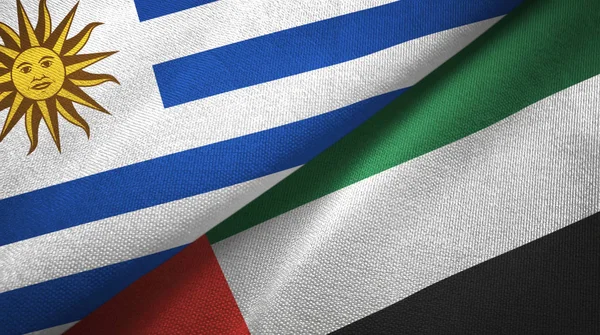 Uruguay und vereinigte arabische emirate zwei flaggen textilstoff, textur — Stockfoto
