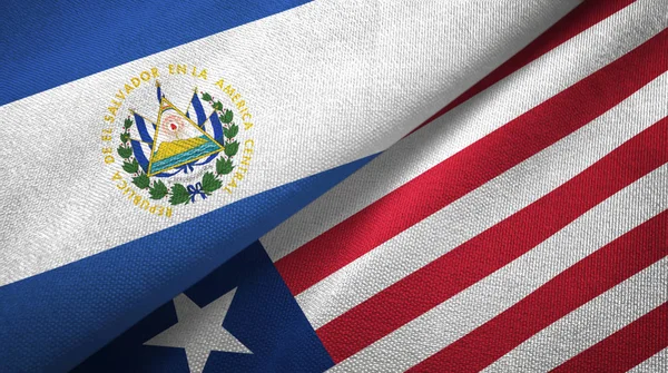 El Salvador e Liberia due bandiere tessuto, tessitura tessuto — Foto Stock