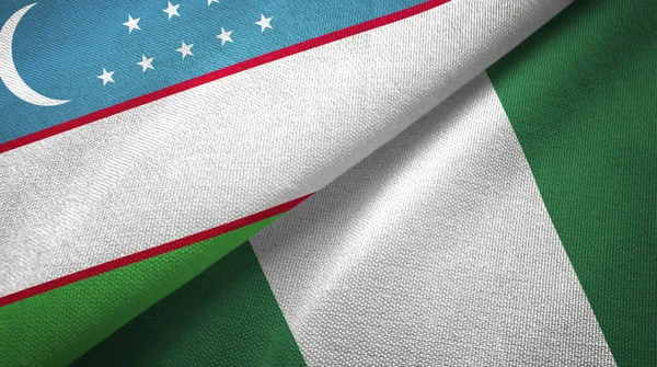 Uzbekistán y Nigeria dos banderas tela textil, textura de la tela — Foto de Stock