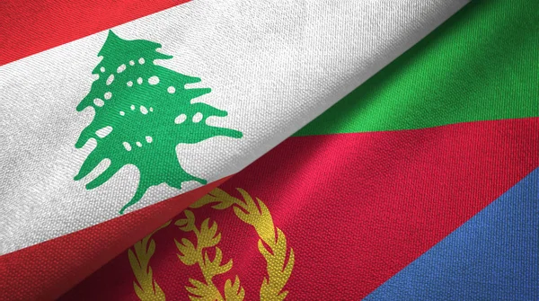Liban et Érythrée deux drapeaux tissu textile, texture du tissu — Photo
