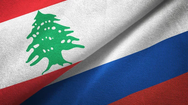 Lebanon and Russia two flags textile cloth, fabric texture