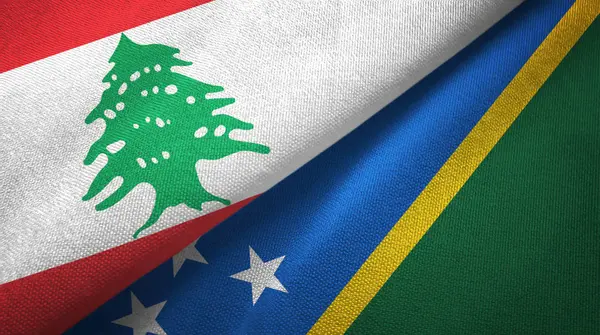 Lebanon and Solomon Islands two flags textile cloth, fabric texture