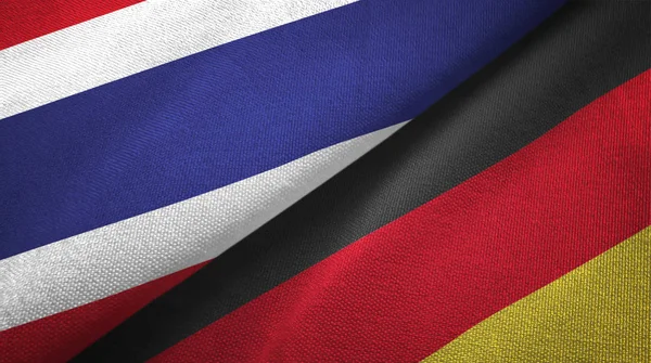Таиланд и Германия два флага текстильная ткань, текстура ткани — стоковое фото