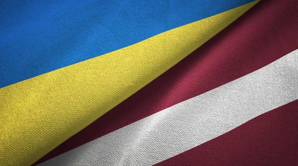 Ukrayna ve Letonya iki bayraklar tekstil kumaş, kumaş doku