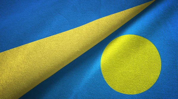 Ucrania y Palau dos banderas tela textil, textura de la tela —  Fotos de Stock