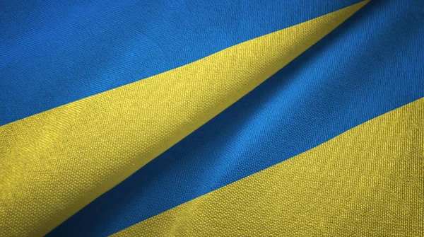 Oekraïne twee vlaggen textiel doek, stof textuur — Stockfoto