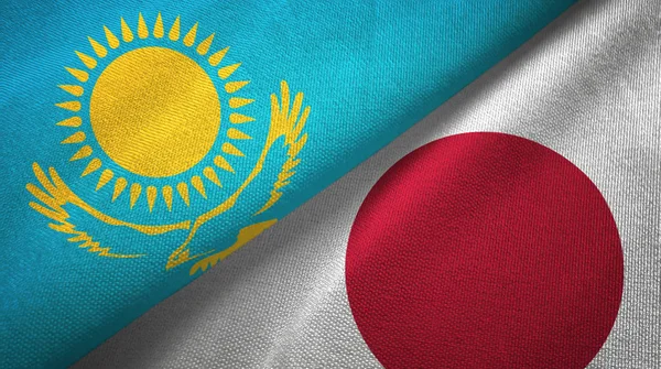 Kazakhstan and Japan two flags textile cloth, fabric texture — Stock Photo, Image