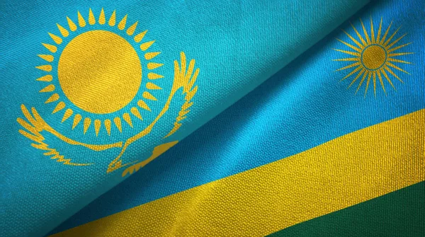 Kazajstán y Ruanda dos banderas tela textil, textura de la tela — Foto de Stock