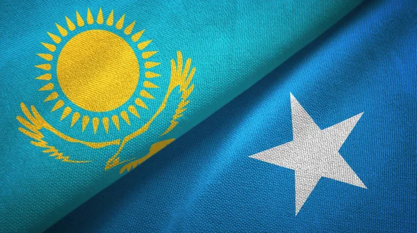 Kazakistan e Somalia due bandiere tessuto, tessitura tessuto — Foto Stock