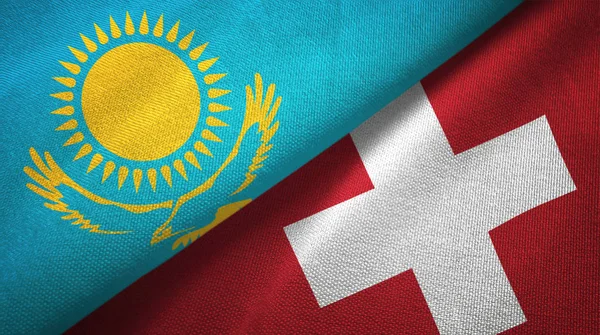 Kazajstán y Suiza dos banderas tela textil, textura de la tela —  Fotos de Stock