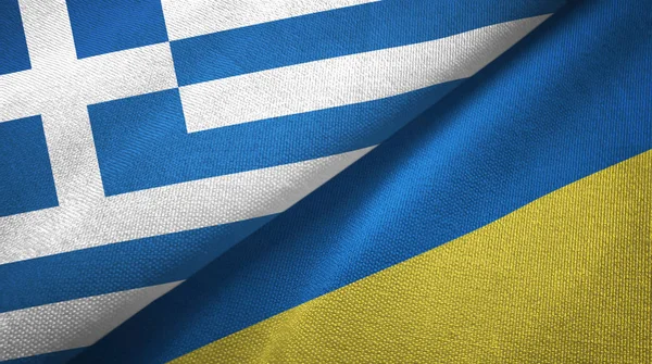 Griekenland en Oekraïne twee vlaggen textiel doek, weefsel textuur — Stockfoto